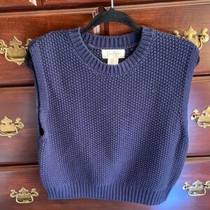 A cute little vest sweater in true navy. Size M.